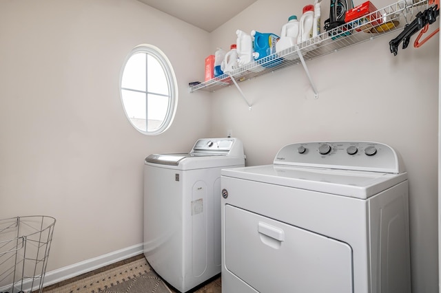 laundry room with washing machine and clothes dryer