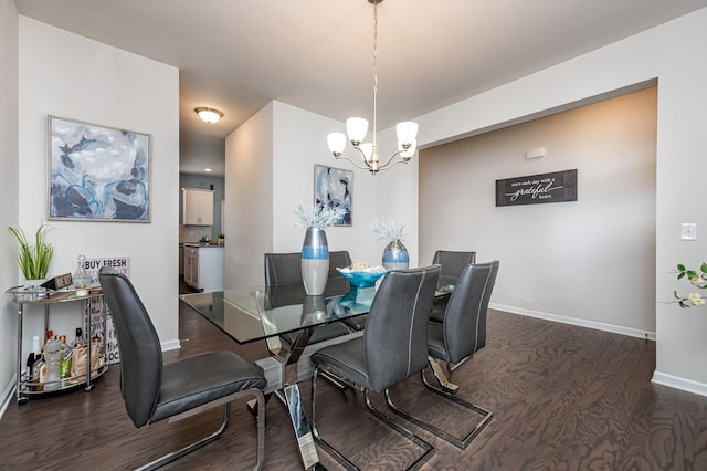 dining space featuring a notable chandelier and dark wood-type flooring