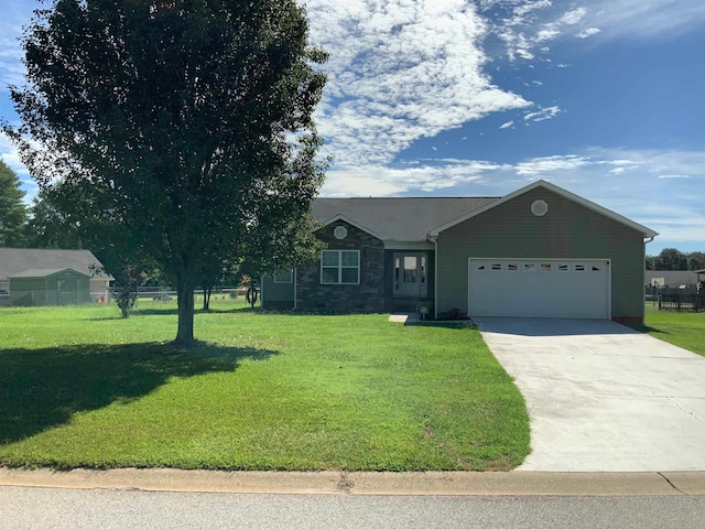 ranch-style home with a front yard and a garage
