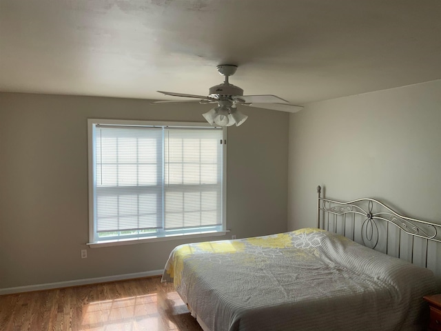 bedroom featuring ceiling fan and light hardwood / wood-style flooring