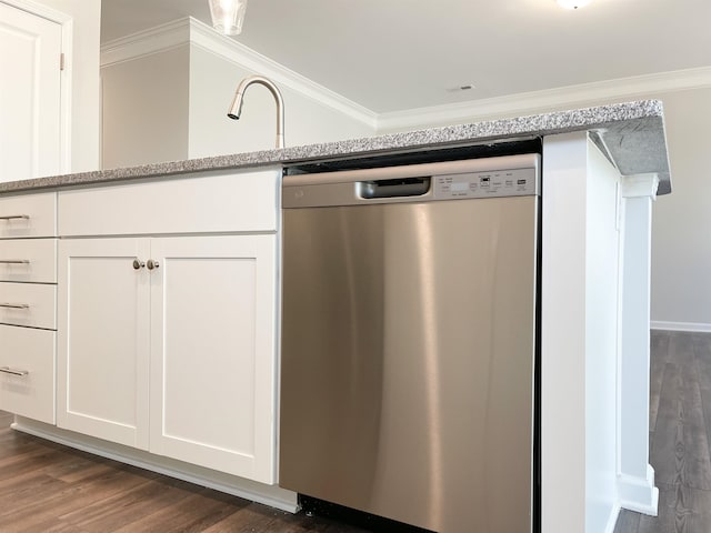 kitchen with white cabinetry, ornamental molding, stainless steel dishwasher, light stone countertops, and dark wood-type flooring