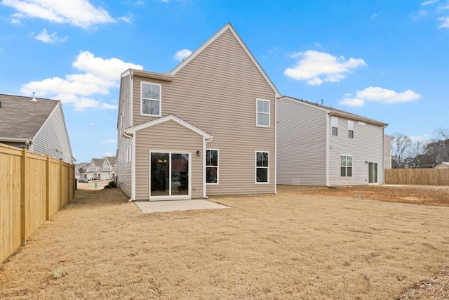 rear view of property featuring a patio area