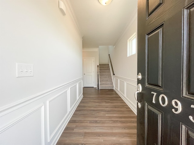 interior space featuring ornamental molding and hardwood / wood-style floors