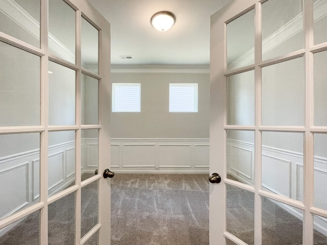 spacious closet with carpet and french doors