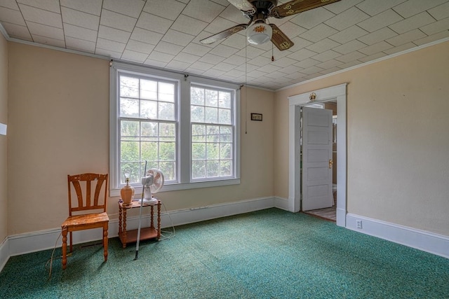 unfurnished room featuring carpet flooring, ceiling fan, and ornamental molding