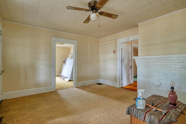 unfurnished bedroom featuring light carpet, ornamental molding, and ceiling fan