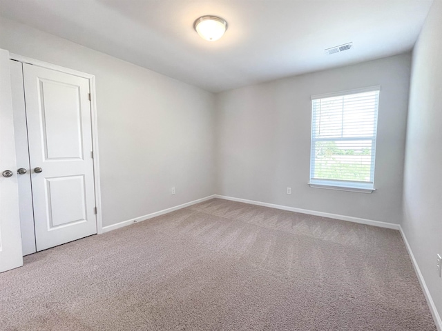 empty room with carpet flooring