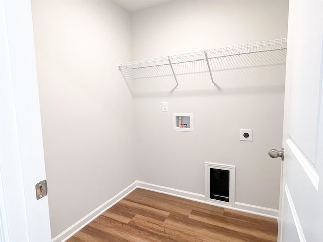 laundry area with hookup for a washing machine, hookup for an electric dryer, and hardwood / wood-style flooring