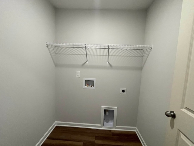 laundry room with hookup for a washing machine, electric dryer hookup, and dark wood-type flooring