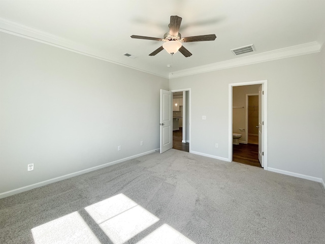 unfurnished bedroom with light carpet, crown molding, ceiling fan, and ensuite bathroom