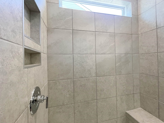 interior space with a tile shower