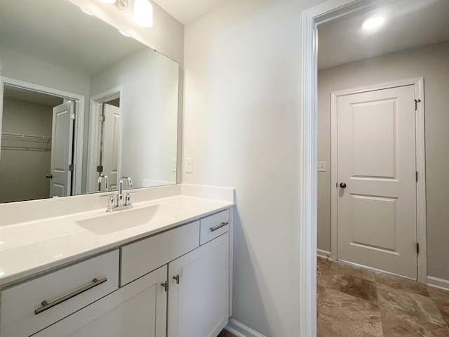 bathroom featuring tile floors and vanity