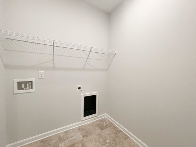 clothes washing area with hookup for a washing machine, hookup for an electric dryer, and light tile flooring