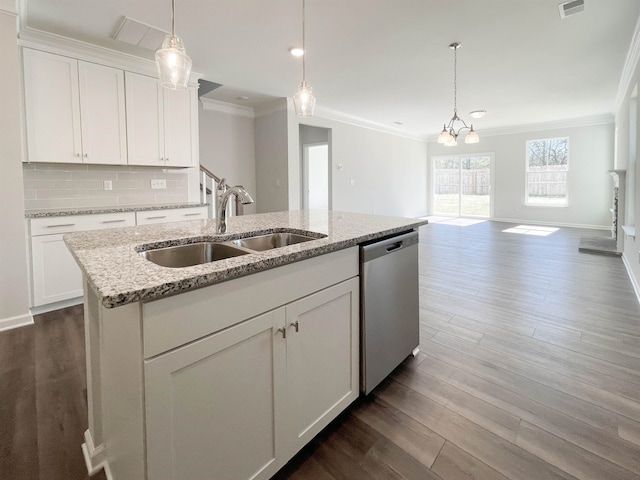 kitchen with stainless steel dishwasher, ornamental molding, dark hardwood / wood-style floors, and an inviting chandelier