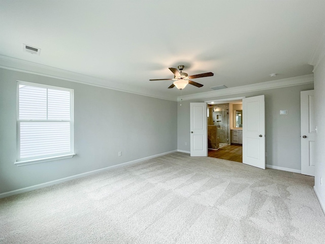 unfurnished bedroom with ceiling fan, light colored carpet, and ornamental molding