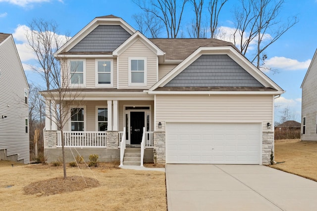craftsman inspired home with stone siding, covered porch, an attached garage, and concrete driveway
