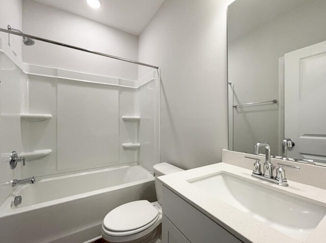 full bathroom with vanity, shower / washtub combination, and toilet