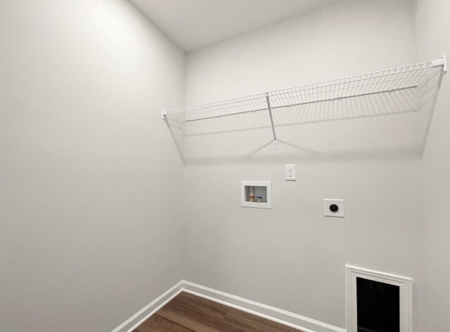 clothes washing area featuring washer hookup, hardwood / wood-style flooring, and hookup for an electric dryer