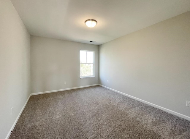 empty room with carpet flooring