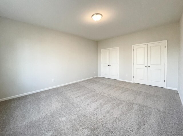 unfurnished bedroom with carpet floors