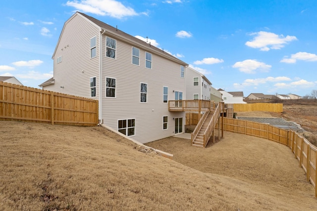 back of house featuring a deck