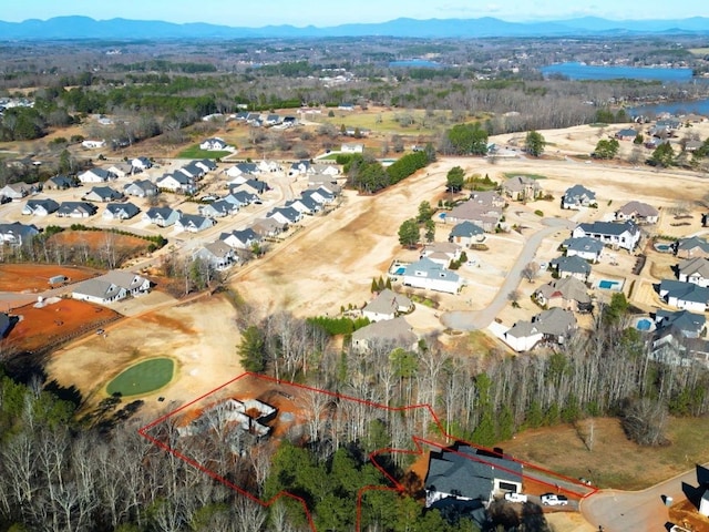 birds eye view of property featuring a mountain view