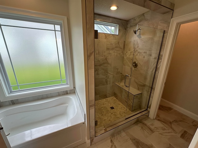 bathroom featuring shower with separate bathtub and tile patterned floors