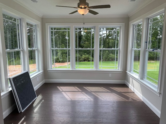 unfurnished sunroom featuring ceiling fan