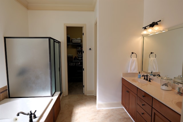 full bath with double vanity, crown molding, a spacious closet, and a sink