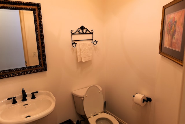 bathroom with a sink and toilet