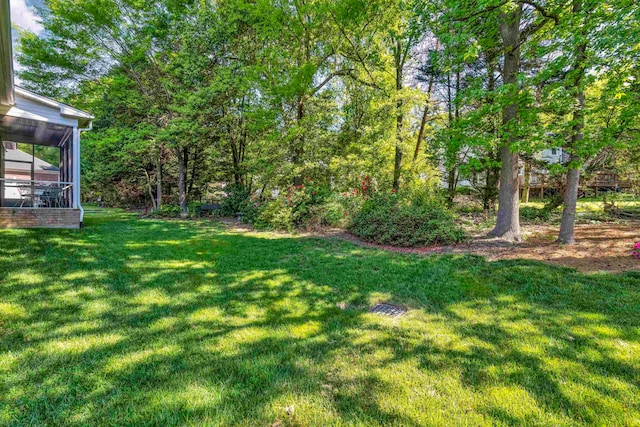 view of yard featuring a sunroom