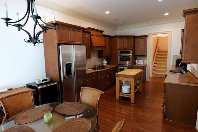 kitchen with dark wood-style flooring, custom exhaust hood, stainless steel appliances, decorative backsplash, and wood counters