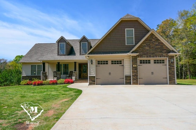 view of front facade with covered porch, a garage, and a front yard