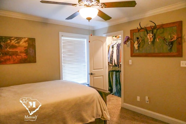 bedroom featuring a closet, ceiling fan, carpet, and crown molding