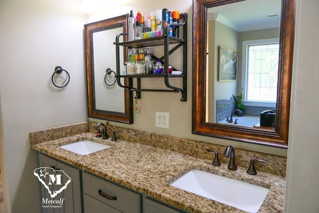 bathroom with ornamental molding, a bath, and double sink vanity