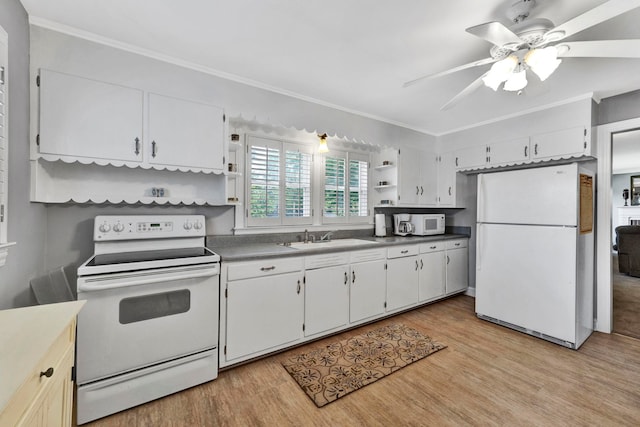 kitchen with light hardwood / wood-style floors, ceiling fan, white appliances, and sink