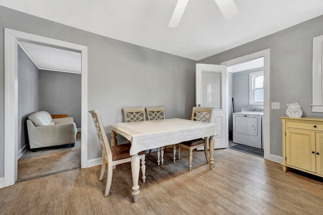 dining area with light hardwood / wood-style flooring and ceiling fan