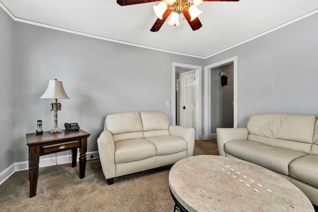 carpeted living room with ornamental molding and ceiling fan