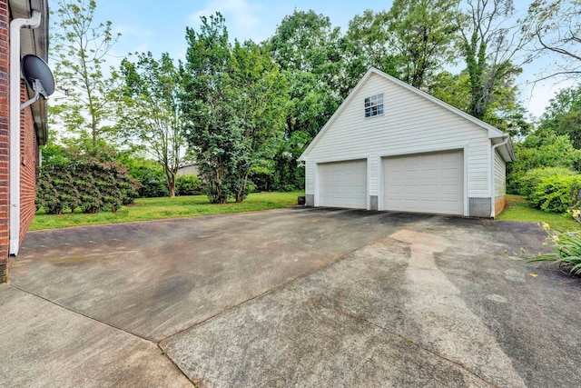 garage featuring a lawn