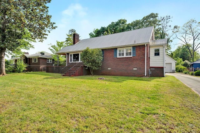 exterior space with an outdoor structure, a front yard, and a garage