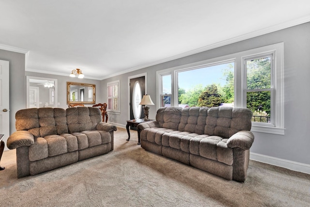 living room featuring a wealth of natural light, crown molding, and carpet