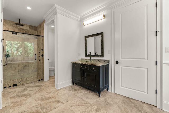 bathroom featuring tile flooring, walk in shower, toilet, ornamental molding, and vanity