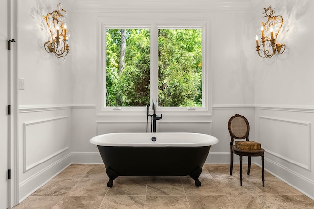 bathroom with tile flooring, a notable chandelier, and crown molding