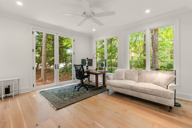 office featuring crown molding, ceiling fan, and light wood-type flooring