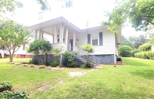 view of home's exterior featuring a yard