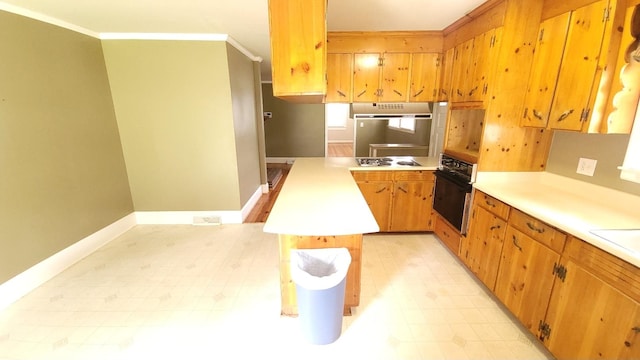 kitchen featuring crown molding, gas cooktop, oven, and light tile flooring