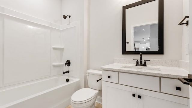 full bathroom with shower / bathing tub combination, vanity, and toilet