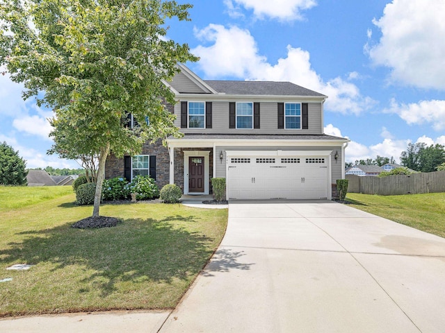 view of front of house with a garage and a front lawn