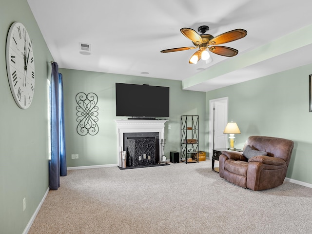 living room featuring ceiling fan and carpet floors