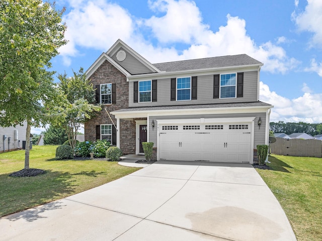 view of front of house with a garage and a front yard